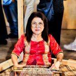 A proud Iban lady carries forward the legacy of her ancestors to the new generations.